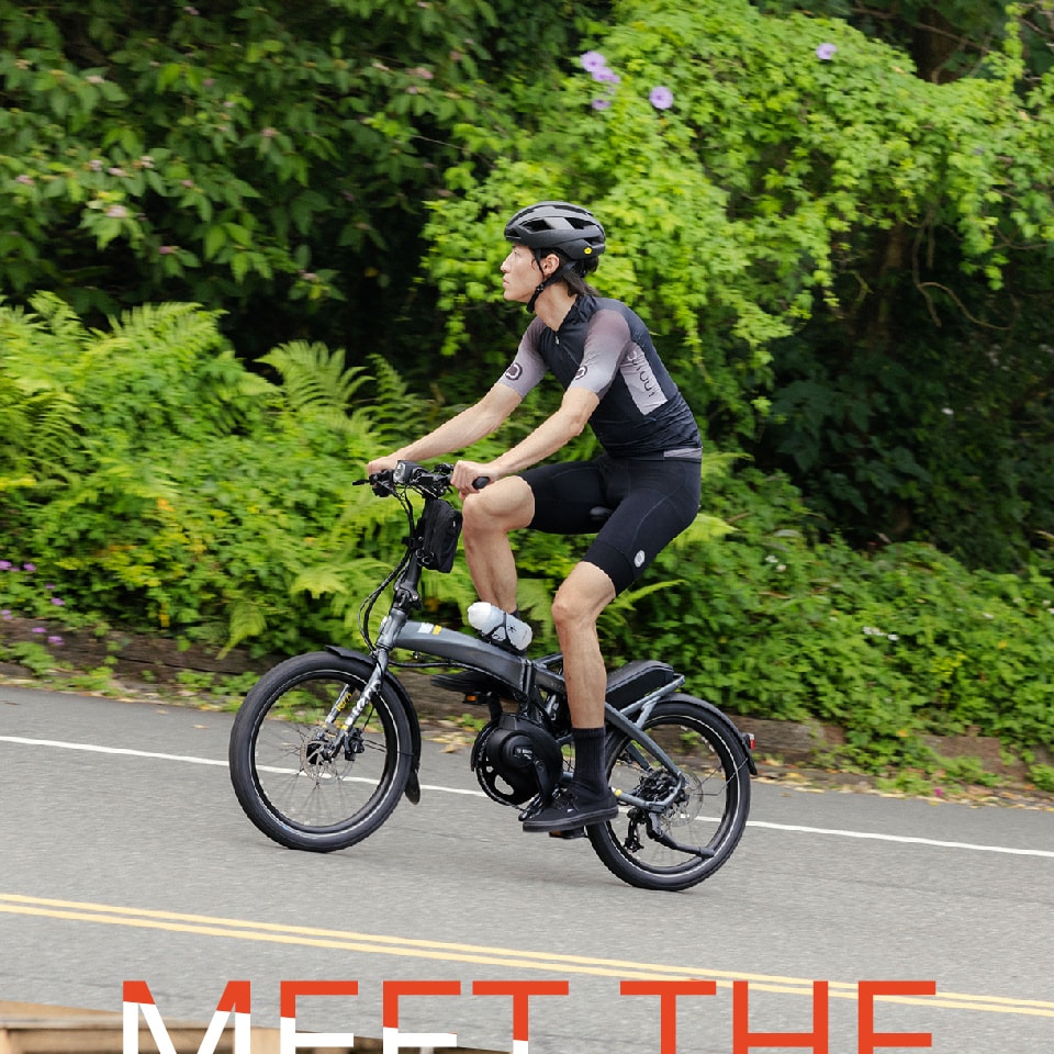 A man ride up the hill with Vektron folding E-bike