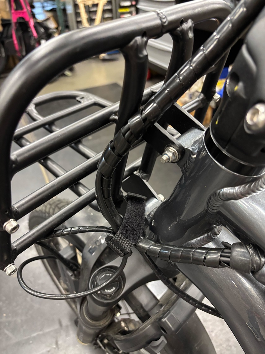 Cable strap looped through Hauler Rack