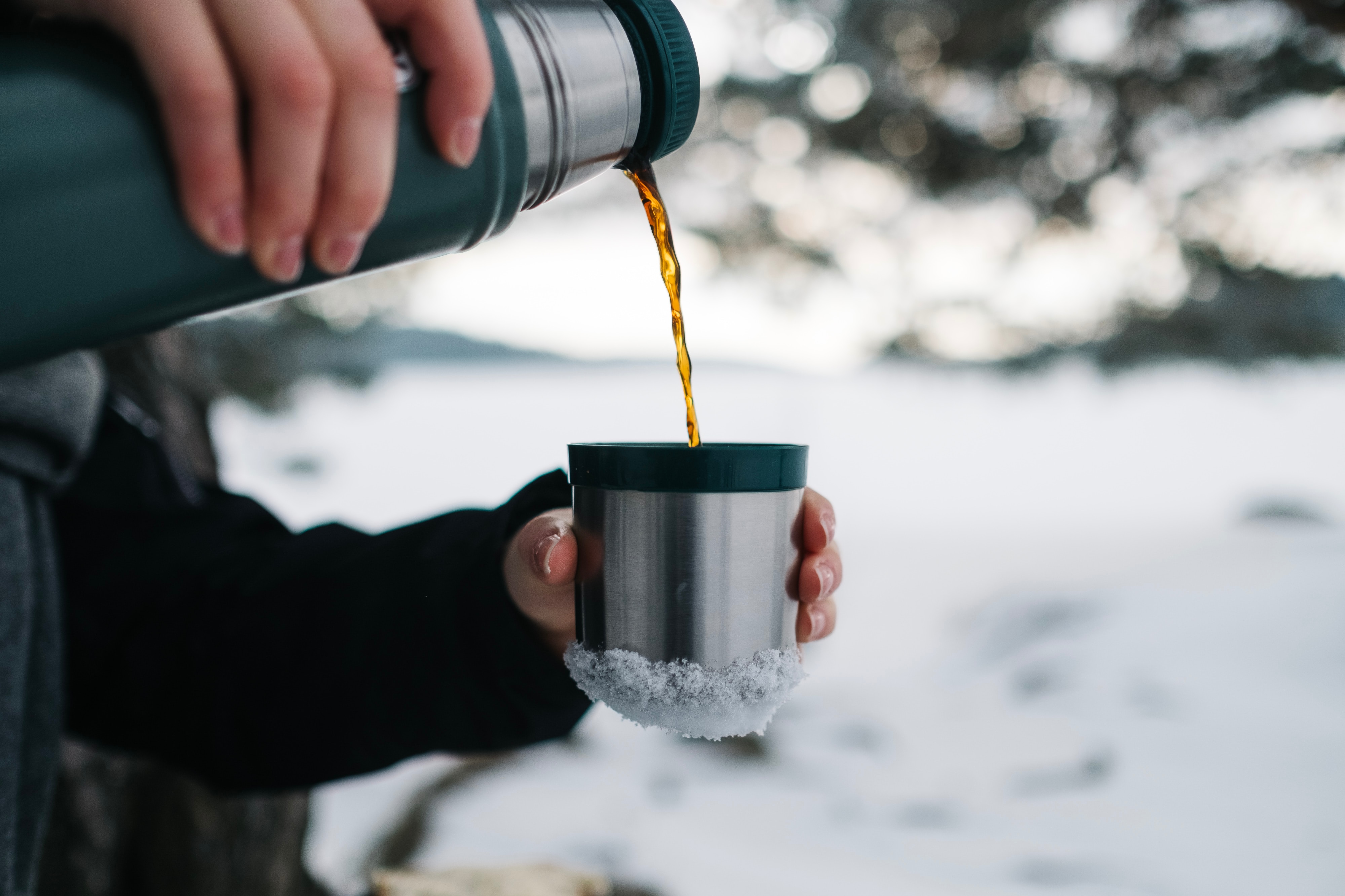 A warm drink in a Thermos makes even the coldest ride more pleasant. Photo by Jonas Jacobsson on Unsplash