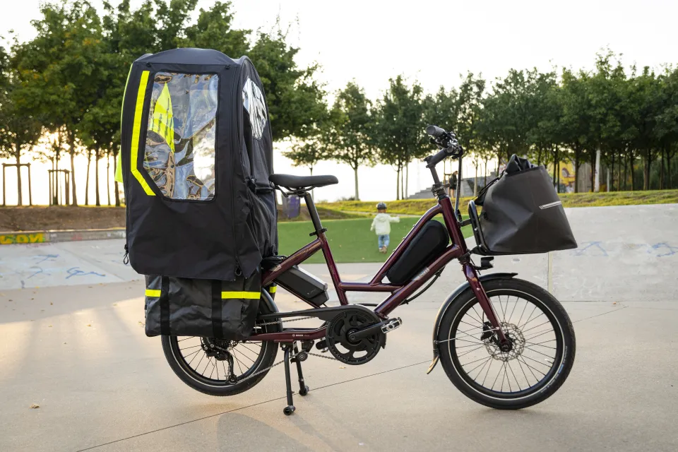 Tern Quick Haul compact e cargo bike with the Clubhouse Fort Mini all-weather passenger compartment installed.