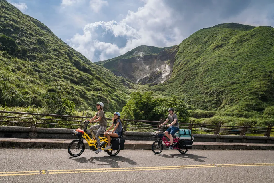 Tern GSDs with a cargo and passenger set up cycling in the mountains