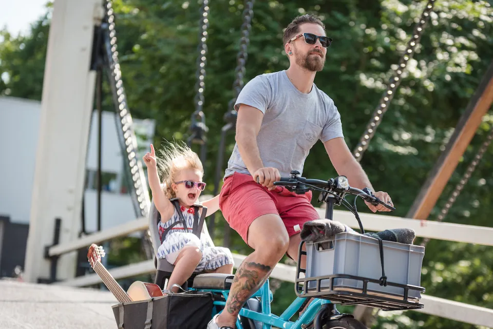 Fully loaded Tern GSD e-cargo bike carrying kid on child seat