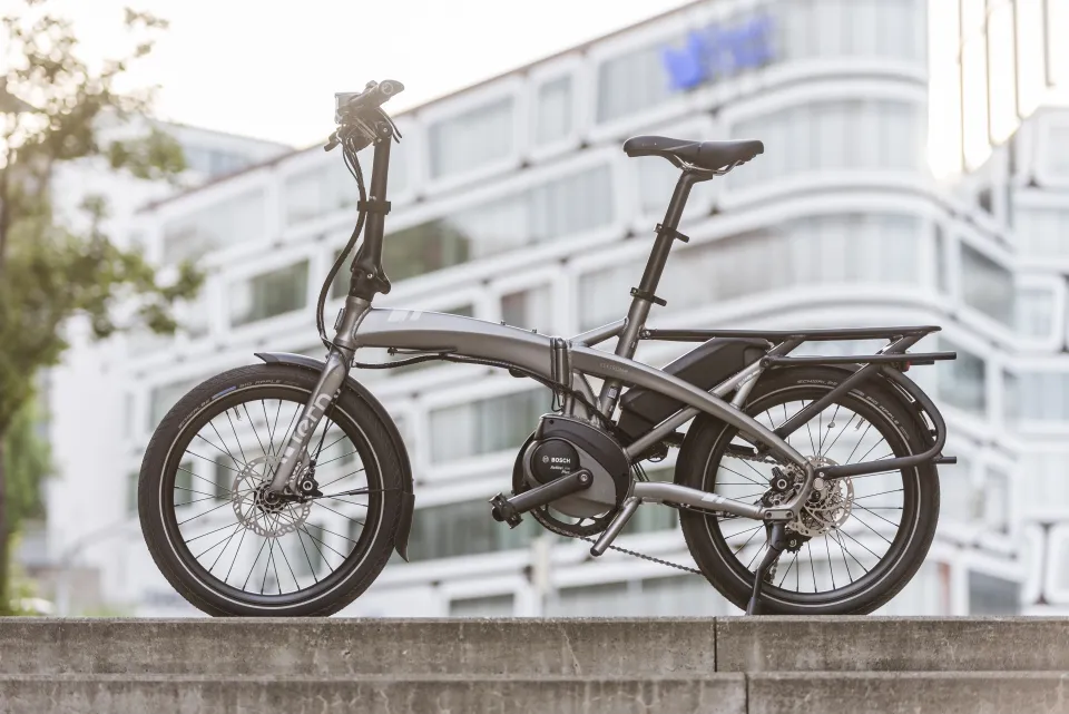 Silver Tern Vektron folding e-bike, unfolded and positioned on a set of stairs.