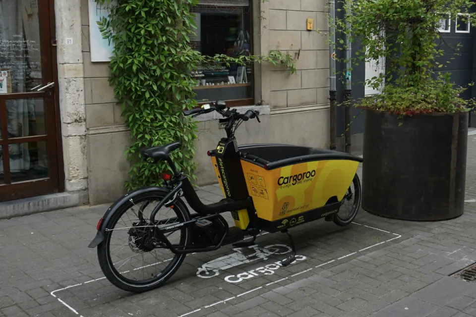 Electric front-loader bike with cargo space in the front.