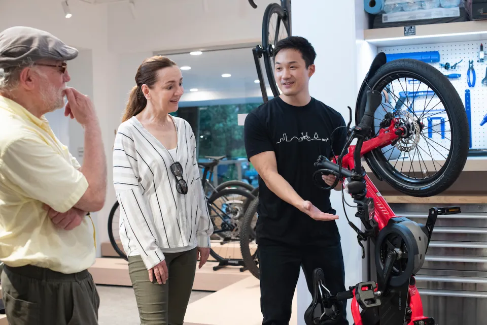 Customers visiting a Tern e cargo bike dealer.