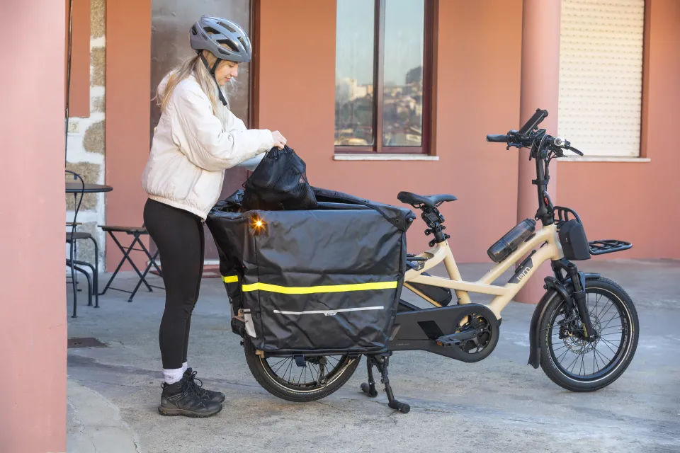 The Tern GSD Gen 3 outfitted with the waterproof Storm Box cargo carrier, plus the Hauler Rack and RidePouch up front.