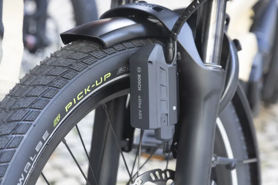 ABS (anti-lock braking system) control unit on the front wheel of a Tern GSD Gen 3 e bike with the Bosch Smart System.