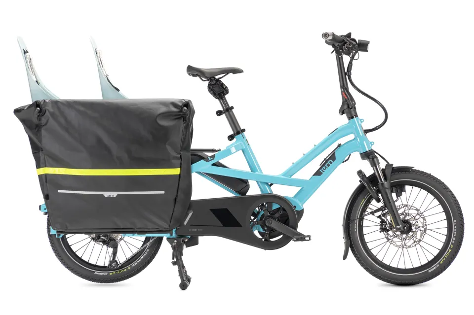 Tern GSD Gen 3 cargo ebike with two child seats inside the Clubhouse passenger carrier and the waterproof Storm Box bike bucket, plus Stow Decks for support.
