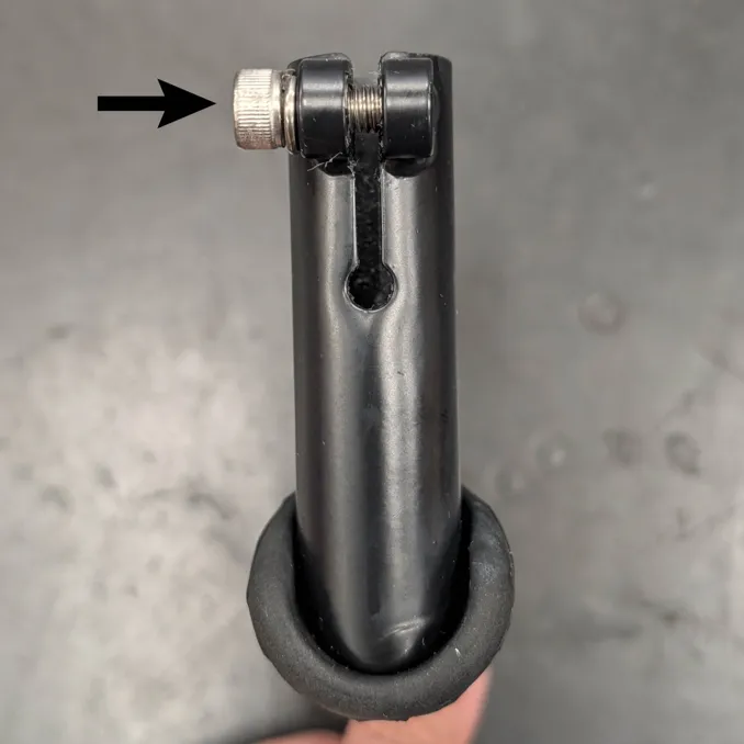 Step 3: Using a flathead screwdriver, carefully widen the gap on the DuoStand Ends and reinstall the locking screw without tightening it.