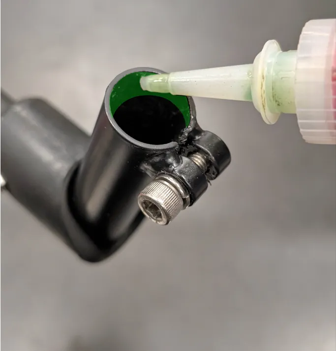 Step 4: Insert the Loctite nozzle into the tube, and apply a layer around the tube’s inner circumference approximately 15 mm from the opening.