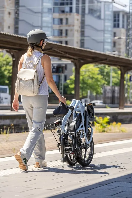 Rolling the Tern Vektron folding ebike along the train platform