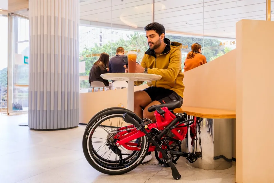 Tern BYB P10 folding bike placed by a desk