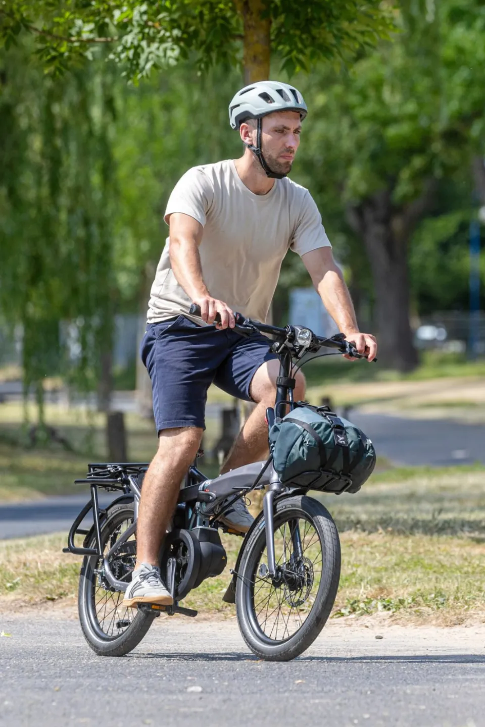 A man riding a Vektron folding e-bike.