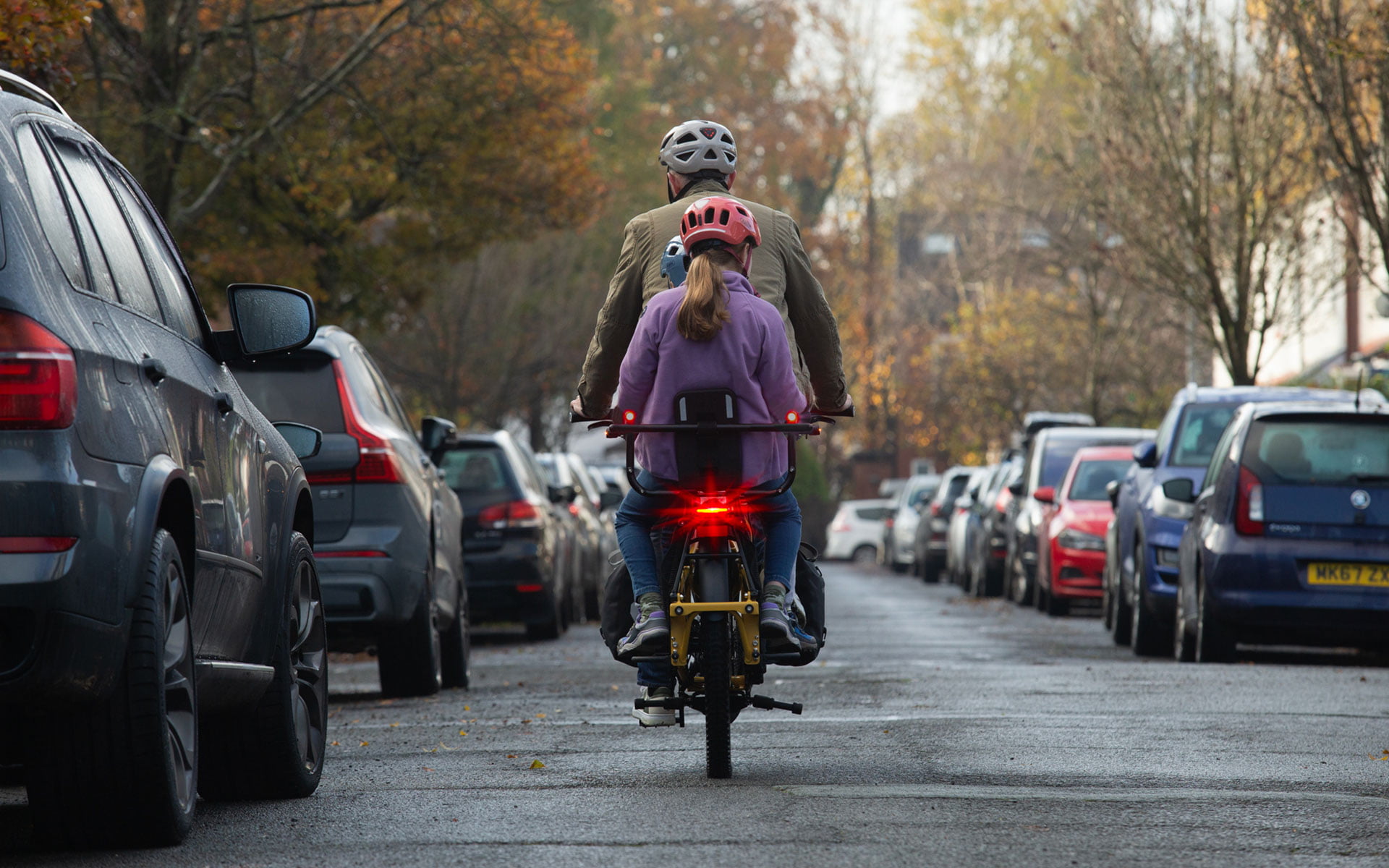 Bike with the built-in LED brake light, riding on the paved road